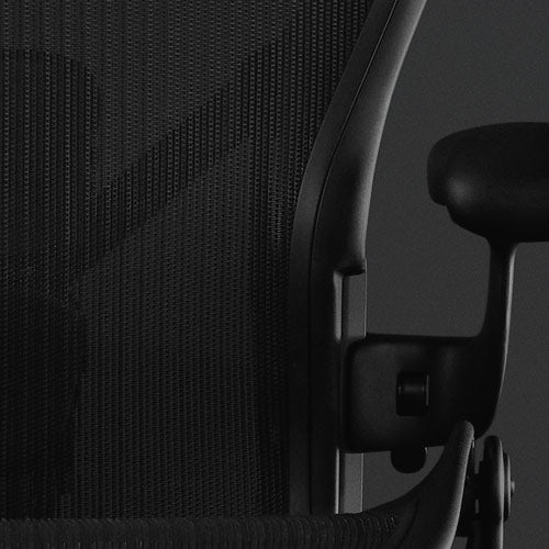 Embody Gaming Chair close-up on Sync Fabric in black with a black background